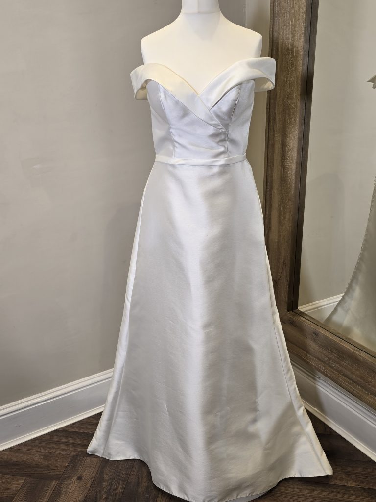 Off the shoulder wedding dress with button detail